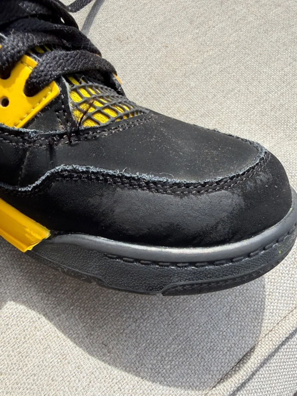 Air Jordan 4 Retro “Thunder” in size 2.5Y GUC.